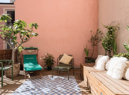 A millennial pink patio at an Airbnb in Paris in the perfect place to hang out.