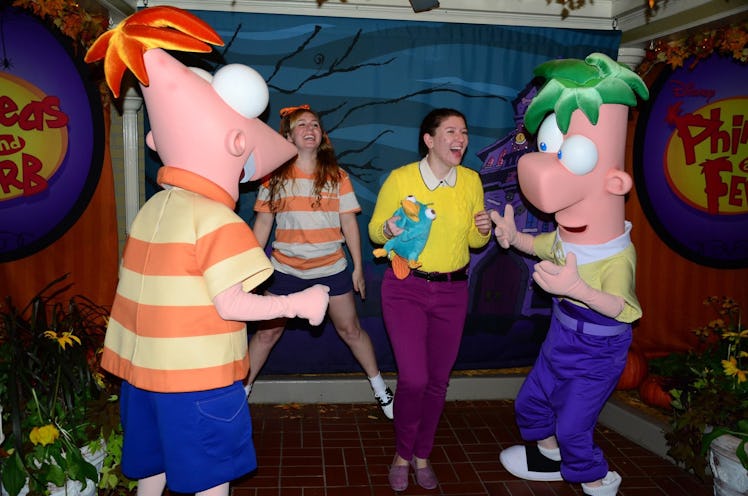 Two friends dressed like 'Phineas and Ferb' would need Disney costume captions for pictures they tak...