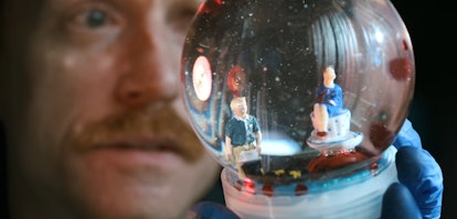 A snow globe depicting Todd and Lydia at a café in "El Camino: A Breaking Bad Movie'