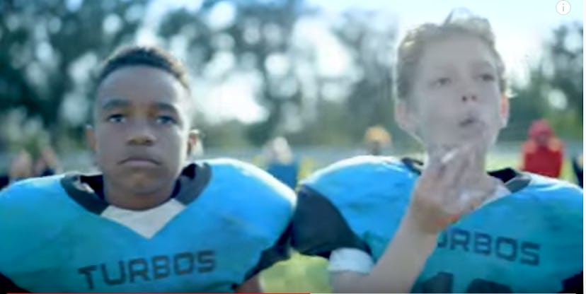 Young football players symbolically smoking to show the effect of concussion 