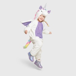 a little girl wearing a unicorn costume from target