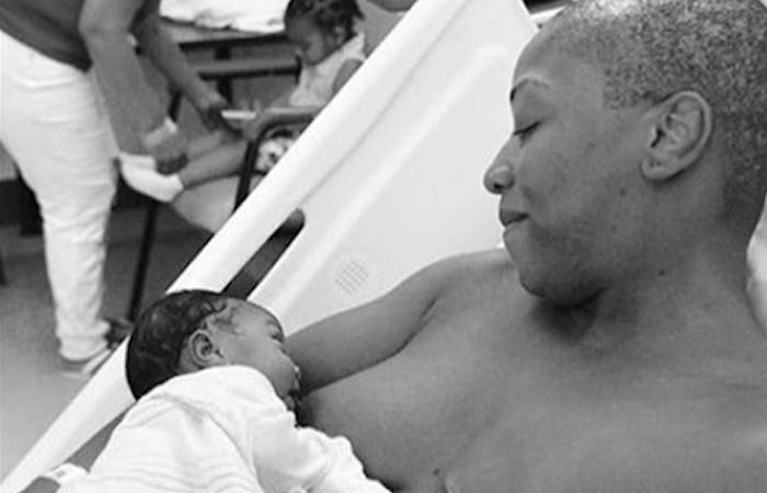 Woman with mastectomy breasfeeding newborn baby