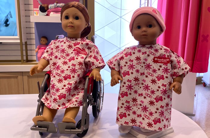 American Girl dolls at hospital in NYC in hospital gowns and wheelchair