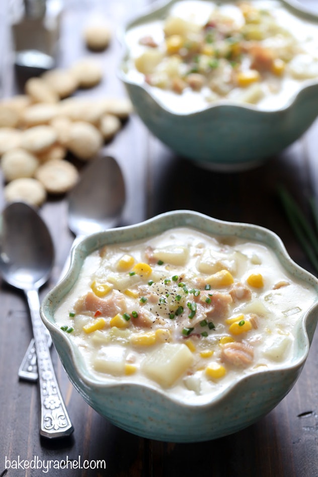 slow cooker clam and corn chowder in a bowl with spoon on the side