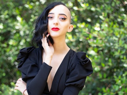 Gabriela Herstik, the author of 'Inner Witch,' poses in a black dress.