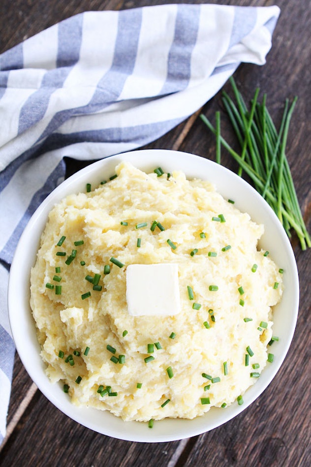 slow cooker mashed potatoes in a bowl on a wooden table