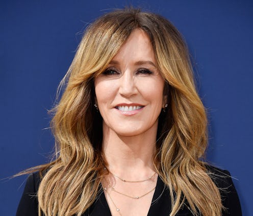 Felicity Huffman reported to prison for her role in the college admissions scandal