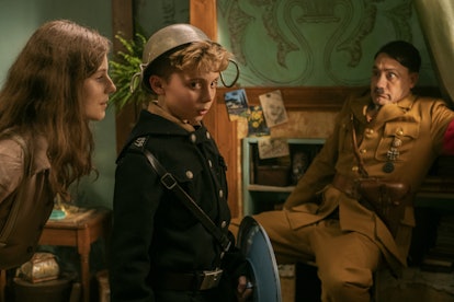 Thomasin McKenzie as Elsa, Roman Griffin Davis as Jojo, and Taika Waititi as Hitler in Jojo Rabbit