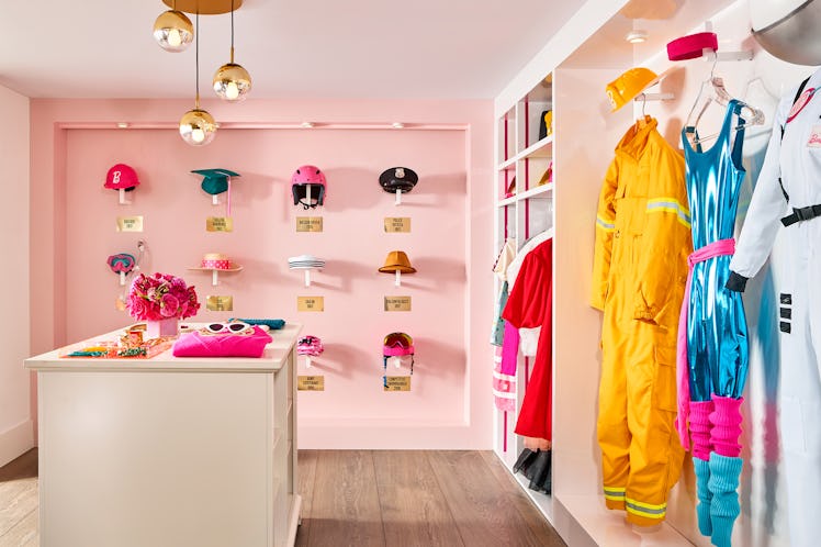 Walk in closet at barbie malibu dream house complete with Barbie outfits
