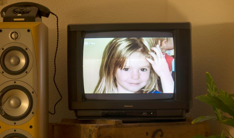A photo of British girl Madeleine McCann aka Maddie is displayed on a TV screen.
