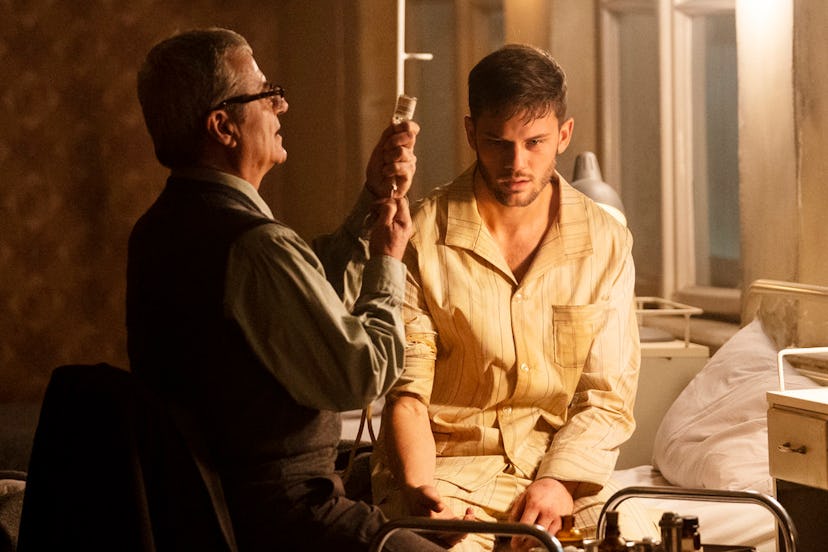 J. Randolph Bentley (Jeremy Irvine) encounters Dr. Meisner (Martin Umbash) in USA's 'Treadstone.' 