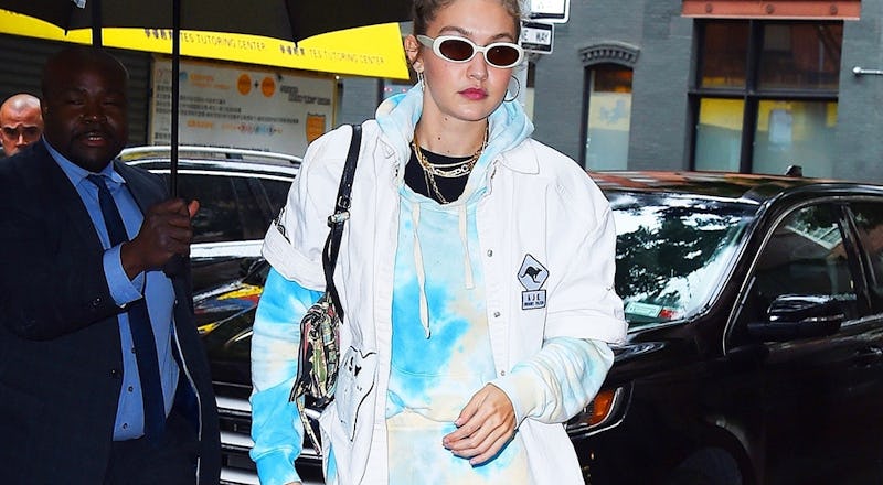 Gigi Hadid wears a tie dye sweatsuit by Wsly Vintage.