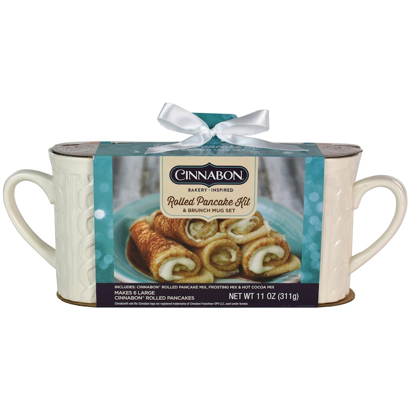The Cinnabon Rolled Pancake Kit comes with pancake mix, hot cocoa mix, icing mix, and two mugs. 