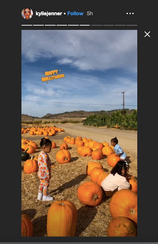 True, Dream, and Stormi play in a pumpkin patch.