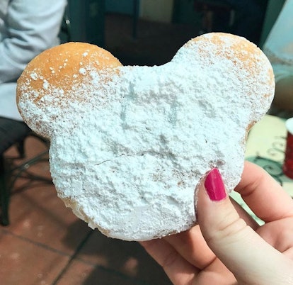 A Mickey Mouse-shaped beignet at Disneyland needs a Mickey-shaped food caption for Instagram.