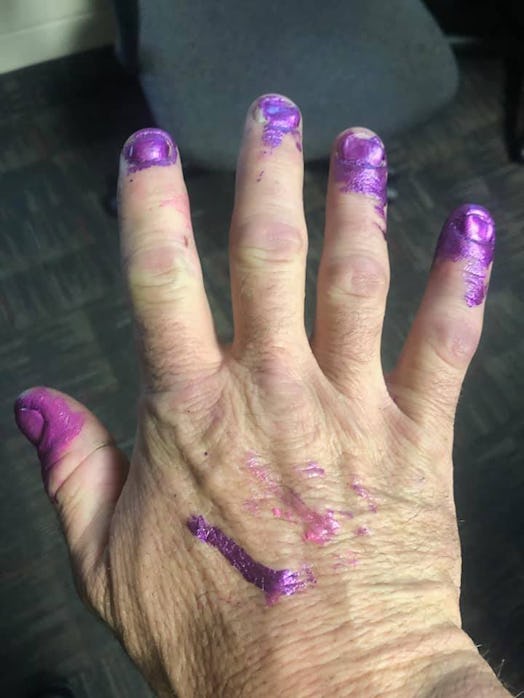 Firefighters let a toddler paint their nails after a car crash.