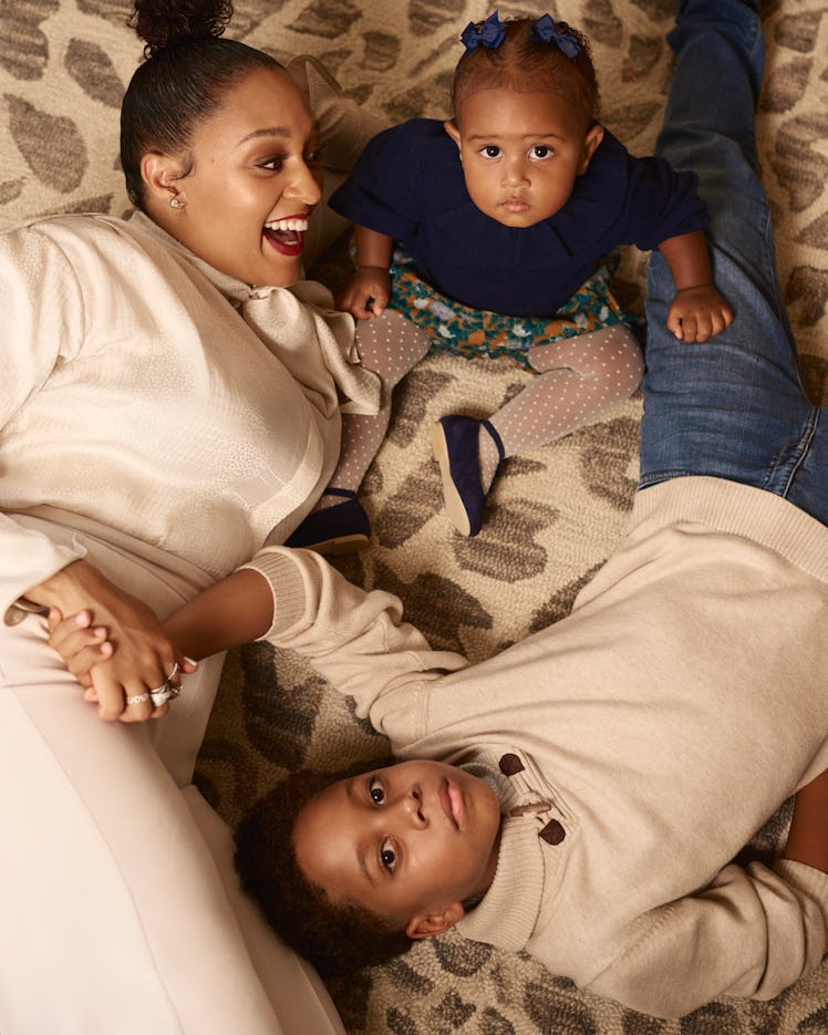 Tia Mowry and her children Cree and Cairo appear in Romper's Holiday Issue 2019.
