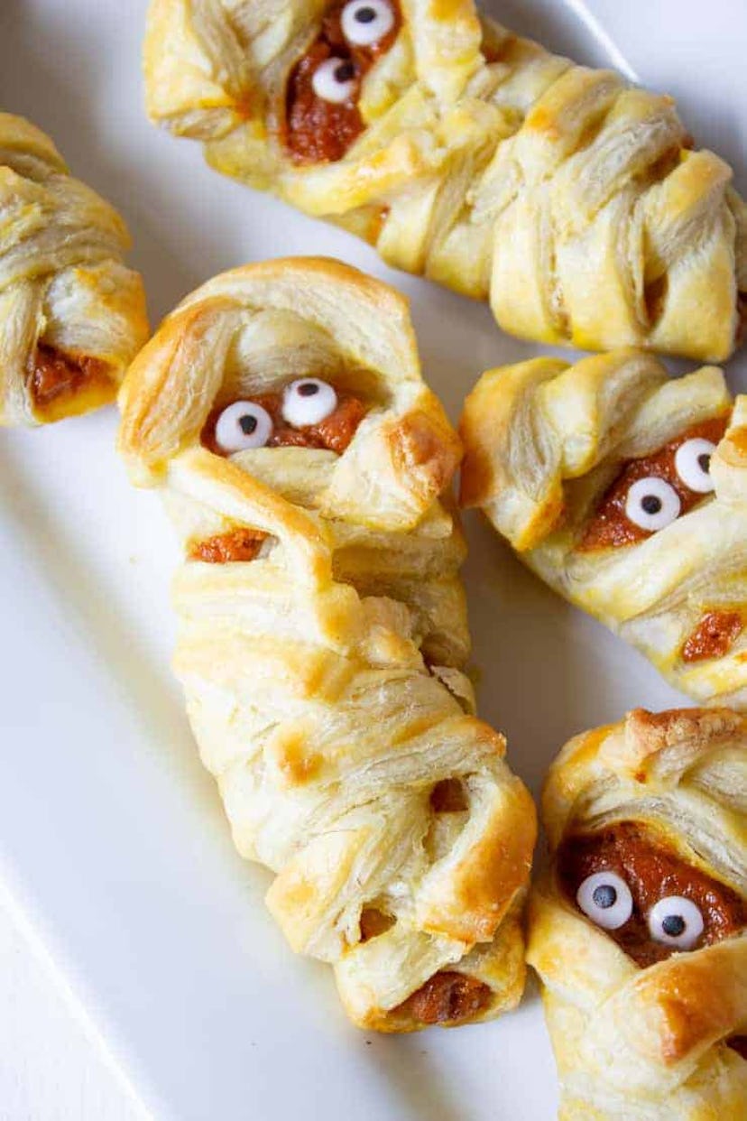 These Halloween mummy-shaped hand pies are fun and easy to make.