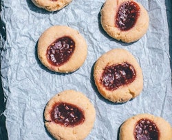 four butter cookies with jam