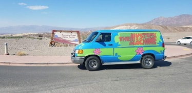 The Mystery Machine from 'Scooby-Doo' sits in the desert and is available to rent on Turo for Hallow...