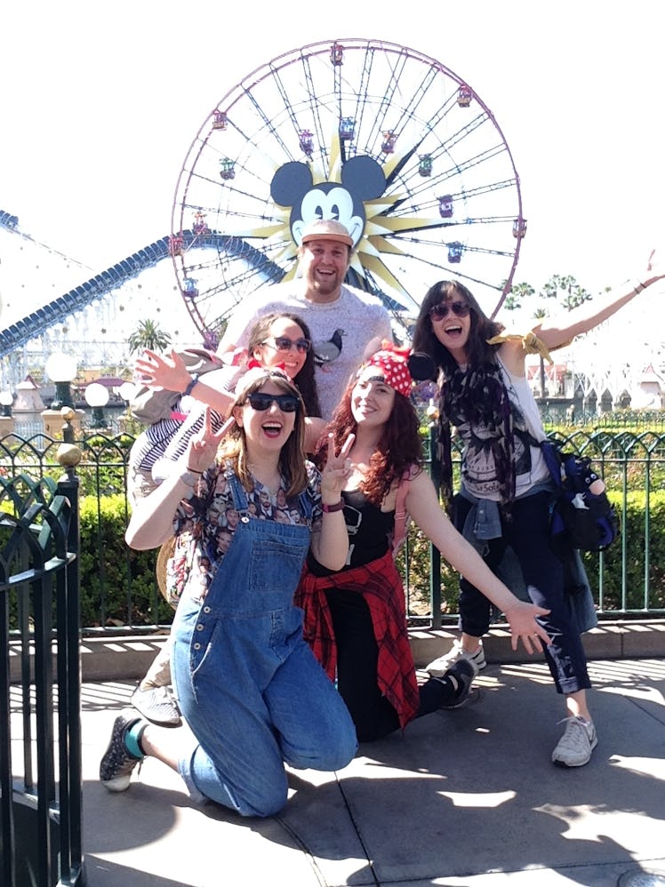 Friends pose in front of the pier at Disney's California Adventure Park. 