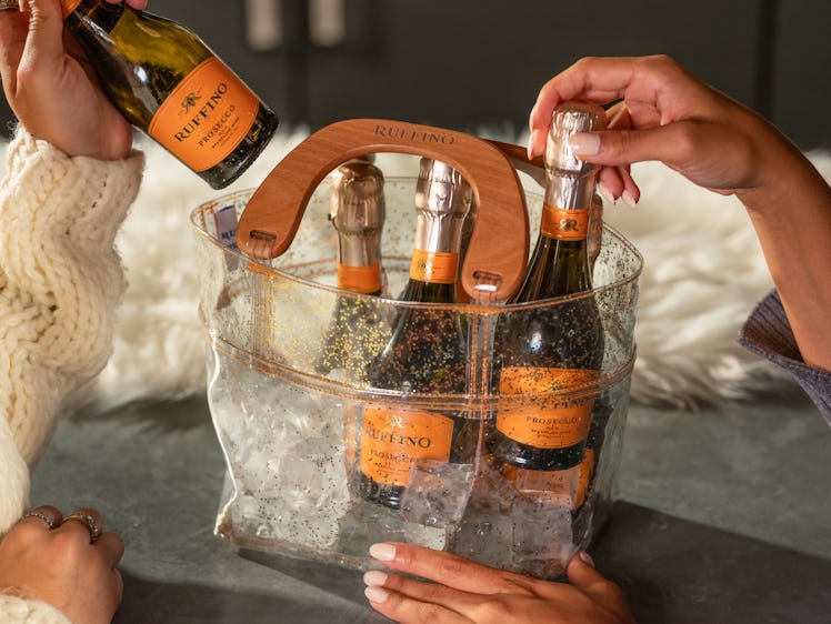 The Ruffino Prosecco Holiday Six-Pack comes in a festive sparkly purse.