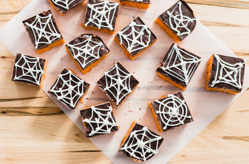 Spiderweb rice cereal treats make a spooky Halloween snack for the classroom. 