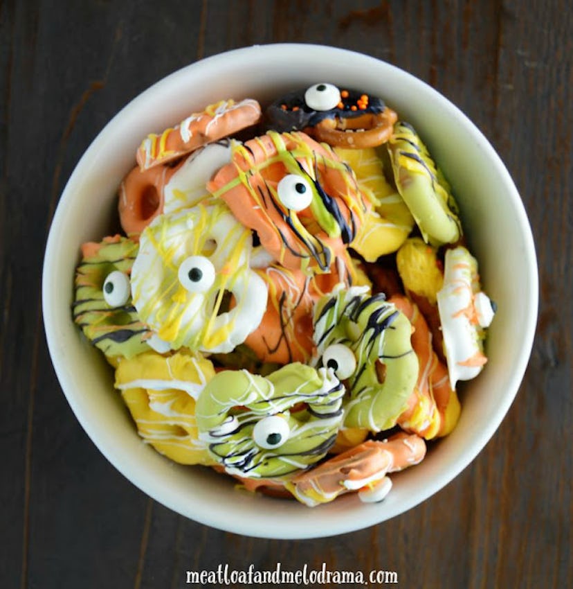 Orange, yellow, and green candy-coated pretzels are perfect Halloween snacks for the classroom. 