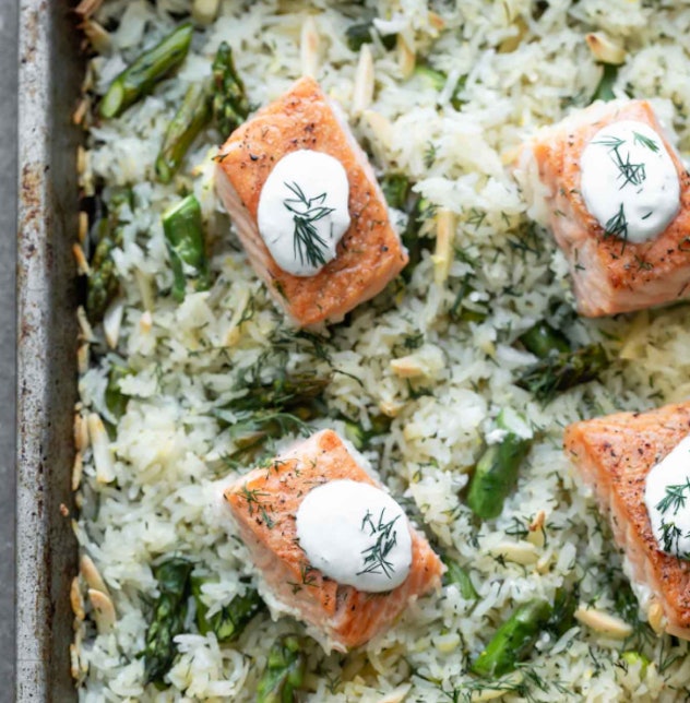  Sheet Pan Salmon and Rice with Lemon Dill Sauce recipe from Cooking for keeps is a meal with plenty...