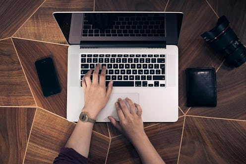 A person types at a laptop. As work hours become more flexible, more people are feeling the pressure...