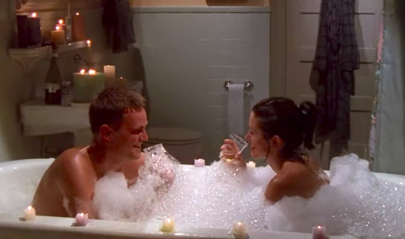Chandler and Monica in the bath with candles