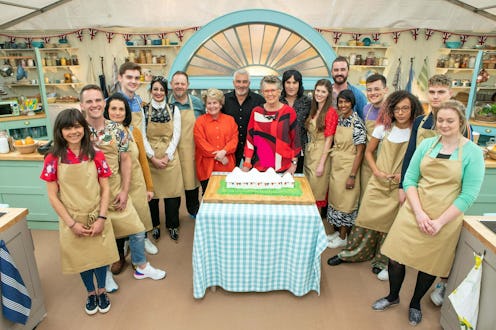 The cast of 'The Great British Bake Off's 10th season poses together in the tent.