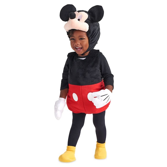 A toddler in a mickey mouse costume