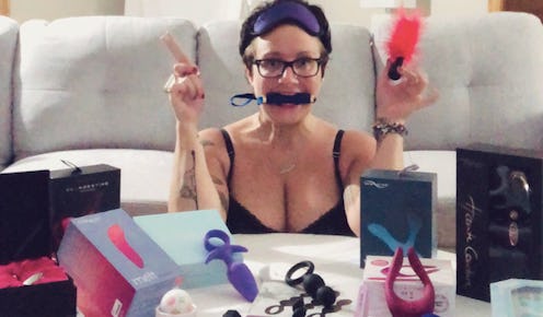 Woman poses with a variety of favorite sex toys.