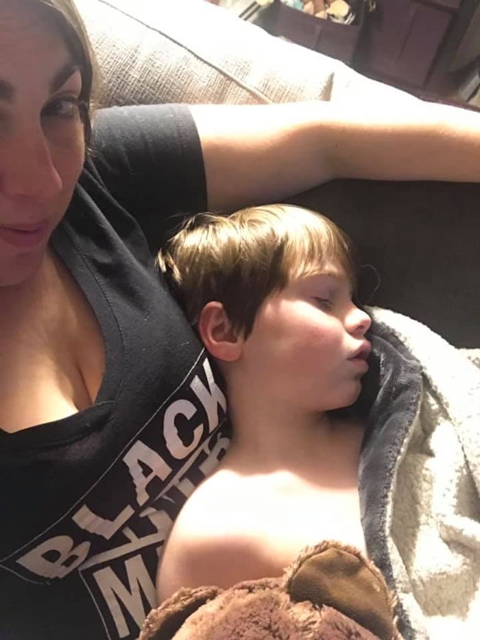 The writer, Jamie Kenney, seen pictures with her son, age 8, sleeping in her arms. 