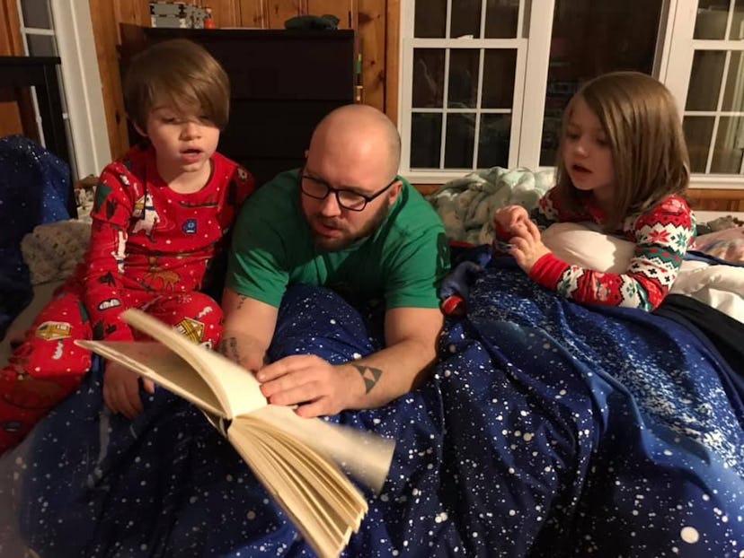 The writer's husband pictures reading a bedtime story to their two children, ages 8 and 4.