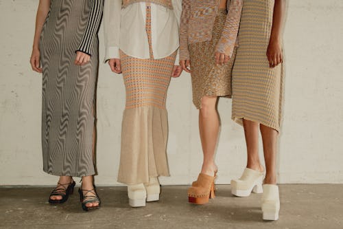 Four women wearing skirt, dress, and shoe trends you need to know about for Spring 2020