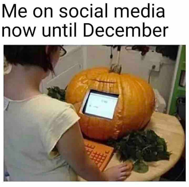 woman with a computer fashioned into a pumpkin