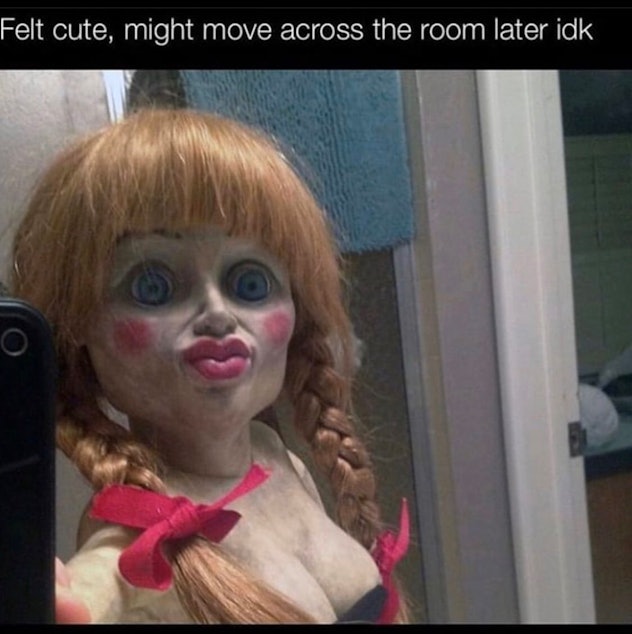 horrific porcelain doll staring at middle distance, ostensibly taking selfie