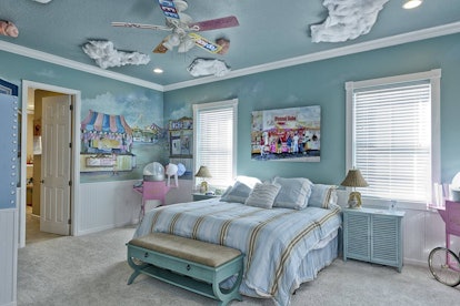 A carnival-themed bedroom features cotton candy clouds and pastel-colored furniture in "The Sweet Es...