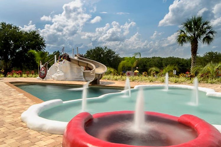 View of ice cream swimming pool with sundae water slide at Sweet Escape Airbnb. 