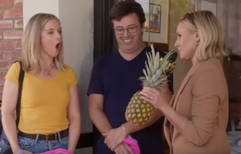 Kristen Bell gives a pineapple to a woman because they apparently are good for vagina health.