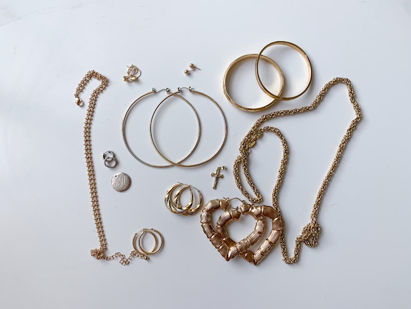 Photo of gold jewelry styles often worn by Latinx people. 