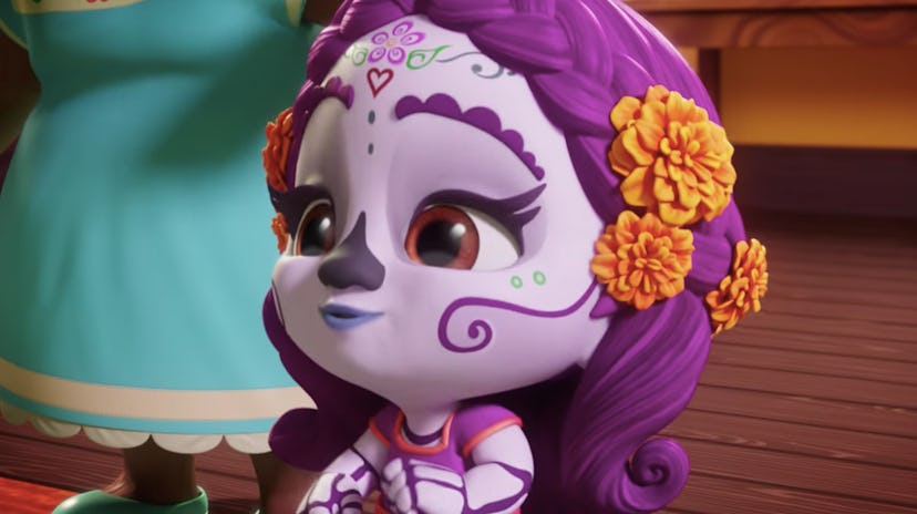 A kitten with Dia de los Muertos makeup from the show super monsters