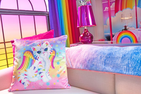 Hotels.com Lisa Frank Flat couch with kitten pillow.