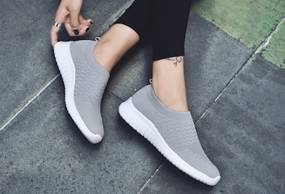 These popular slip-on shoes are made with a knit fabric that hugs your feet for a comfortable, snug ...