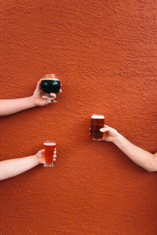 Three people holding up glasses of beer against an orange wall is the perfect post to pair with pump...