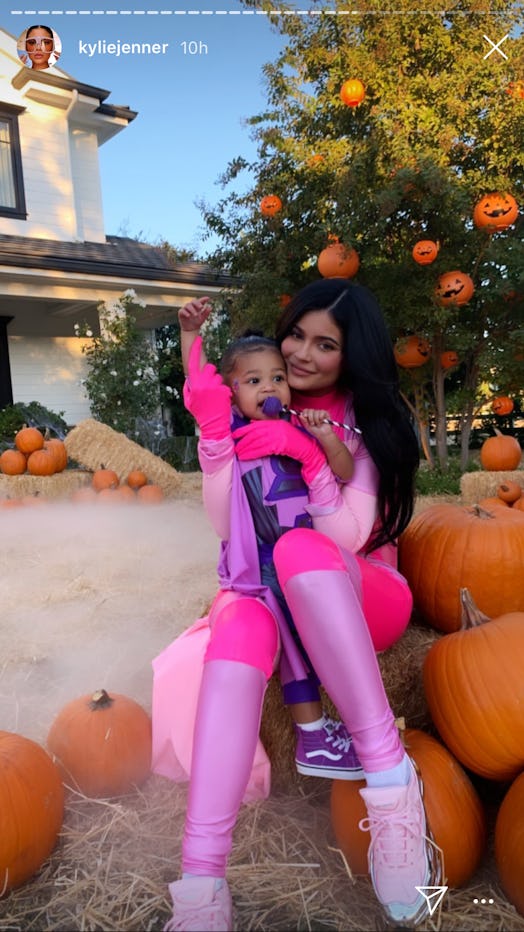Kylie Jenner and Stormi dressed as matching superheros for Halloween.