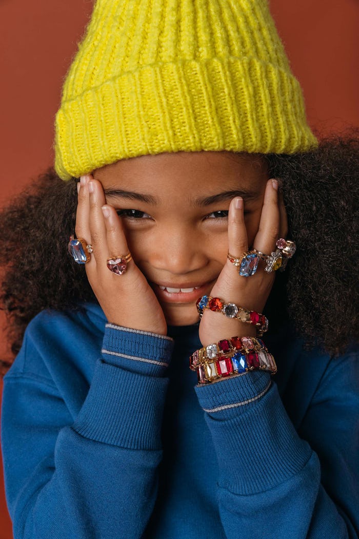 Super Smalls rings and bracelets on a young model 