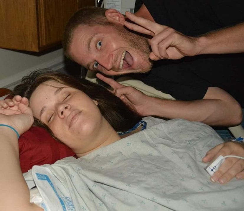Amanda Crowe closing her eyes during labor with her husband next to her